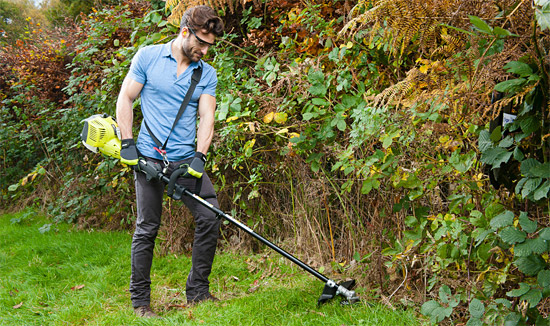 Ryobi petrol brush cutter in action